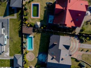 Property line survey showing pools, driveways, landscaping, and neighboring property boundaries in Fairfax Virginia.
